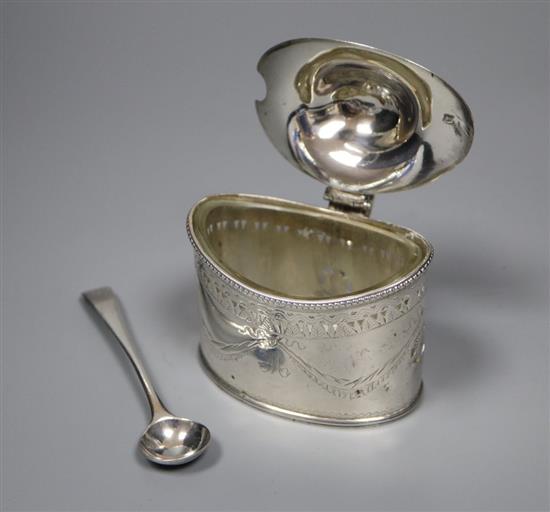 A George III engraved silver oval mustard by Robert Hennell I, London, 1786, 73mm, with later liner and spoon.